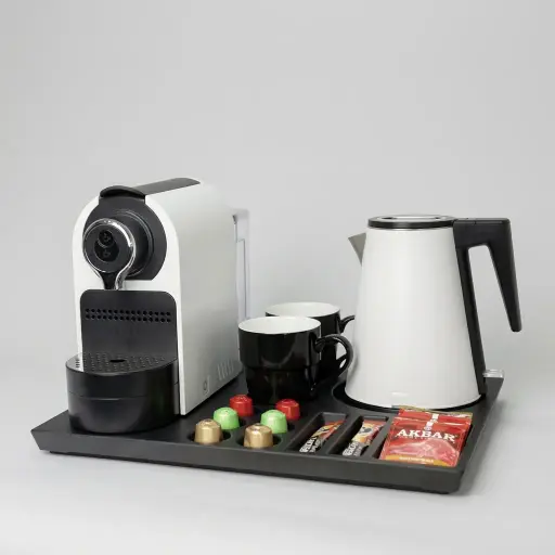 Melamine Tray Set with Strix Seamless Stainless Steel 0.8L Kettle [1035] — CTS-1035 — A welcome-tray set pairing an easy-clean melamine tray with a 0.8L seamless 316 stainless steel kettle and a capsule coffee machine. The double-layer, anti-scald kettle uses a Strix controller and is weldless inside for simple cleaning. The 41.9x31.4cm tray arranges cups, sachets and six espresso capsules, available in black or white.