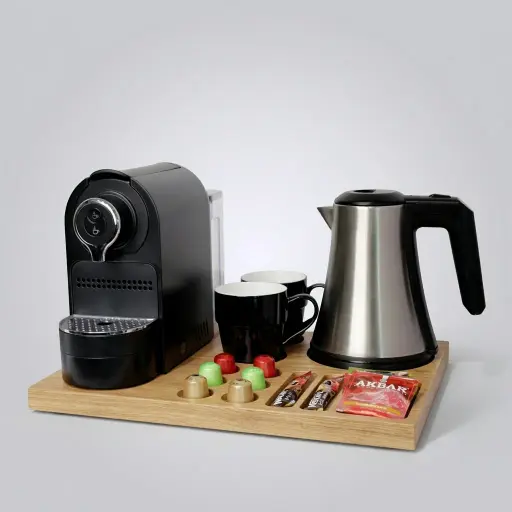Wooden Tray Set with Stainless Steel 0.8L Kettle — CTS-1042 — A welcome-tray set pairing a wooden tray with a 0.8L matt stainless steel kettle and a capsule coffee machine. The durable food-grade 304 steel kettle resists rust and oxidation with automatic shut-off. The 42x31.5cm tray neatly arranges cups, sachets, a spoon and six espresso capsules.