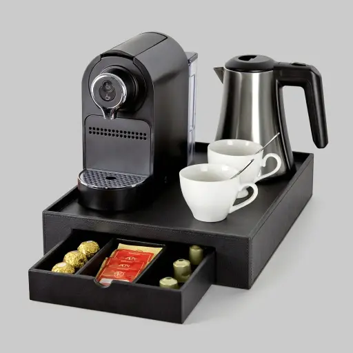 Tray Set with Stainless Steel 0.8L Kettle [1045] — CTS-1045 — A welcome-tray set built around a durable faux leather tray with a pull-out drawer, paired with a 0.8L stainless steel kettle. The drawer holds up to ten espresso capsules plus two compartments for teabags, sugar sticks or spoons, and four protector feet guard the surface. The food-grade 304 steel kettle delivers reliable, rust-resistant performance.