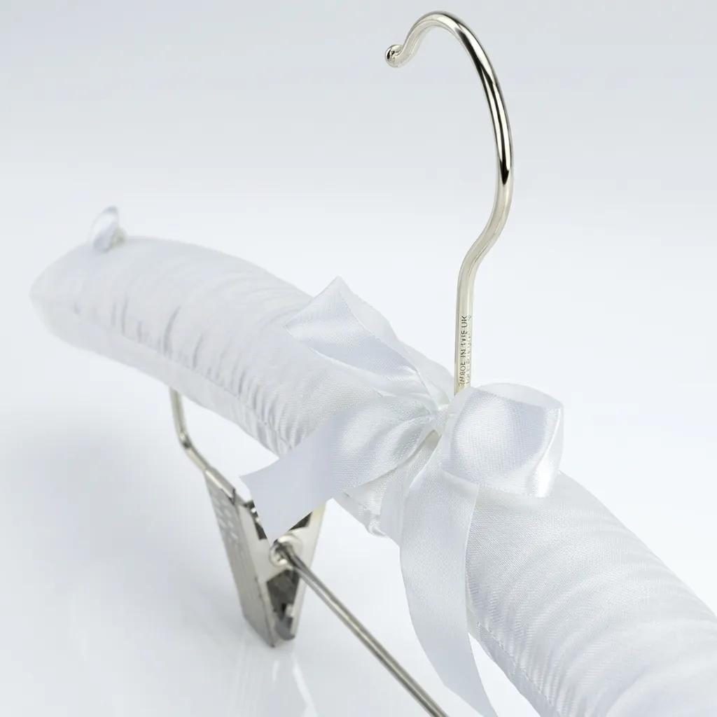 Satin Padded Hanger With Clips — HNG-1034 — A satin-padded hanger with a non-slip rubber-covered hook and built-in clips for trousers and skirts. The soft satin protects garments while a chrome holder adds polish. Packed 100 pieces per carton, black or white. (image 3)