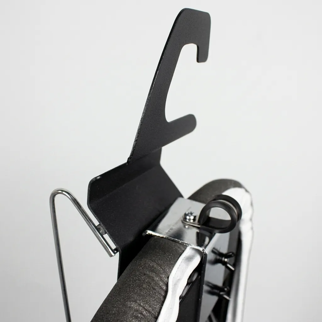 Anti-Theft Ironing Holder [1030] — IRO-1030 — A robust anti-theft ironing holder in durable metal and heat-resistant plastic that stores the iron and board securely. A cable hook conceals the cord while rubberized rails grip the iron in place. Black or silver, 42 x 14 x 13cm. (image 2)