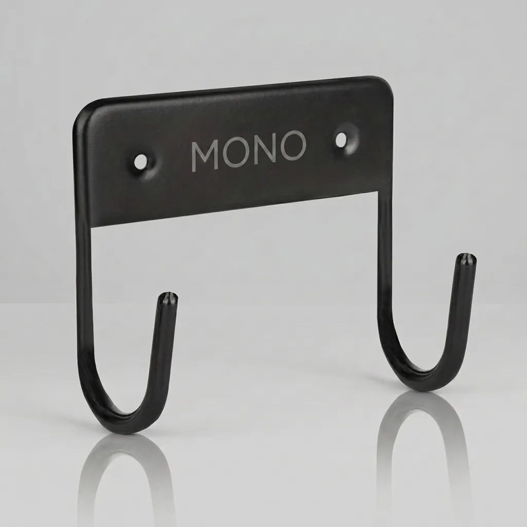 Wall Mounted Ironing Board Hanger — IRO-1032 — A compact metal wall hanger that stores the ironing board neatly when not in use. Strong hooks hold the board securely and free up floor space, mounting easily on the wall or in the wardrobe with the included screws. Suitable for all our ironing boards, sized at 11x12x6cm in black. (image 1)