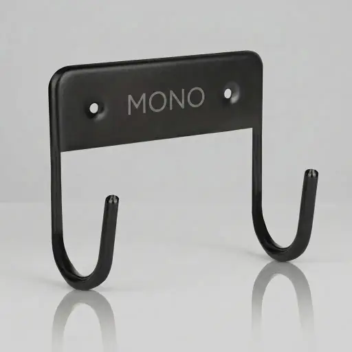 Wall Mounted Ironing Board Hanger — IRO-1032 — A compact metal wall hanger that stores the ironing board neatly when not in use. Strong hooks hold the board securely and free up floor space, mounting easily on the wall or in the wardrobe with the included screws. Suitable for all our ironing boards, sized at 11x12x6cm in black.