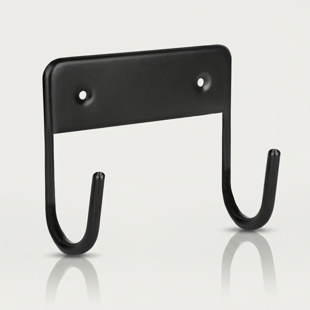 Wall Mounted Ironing Board Hanger — IRO-1032 — A compact metal wall hanger that stores the ironing board neatly when not in use. Strong hooks hold the board securely and free up floor space, mounting easily on the wall or in the wardrobe with the included screws. Suitable for all our ironing boards, sized at 11x12x6cm in black. (image 3)