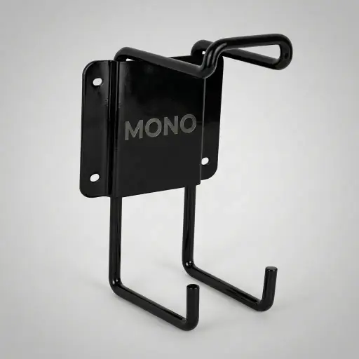Wall-Mounted Ironing Holder — IRO-1033 — A metal wall-mounted holder that stores the iron and ironing board together to save space. A horizontal bracket holds the iron while a vertical bracket keeps the board upright, with a padded, wire-frame build for durability. Suitable for all our irons and boards, mounting on the wall or in the wardrobe, in black.