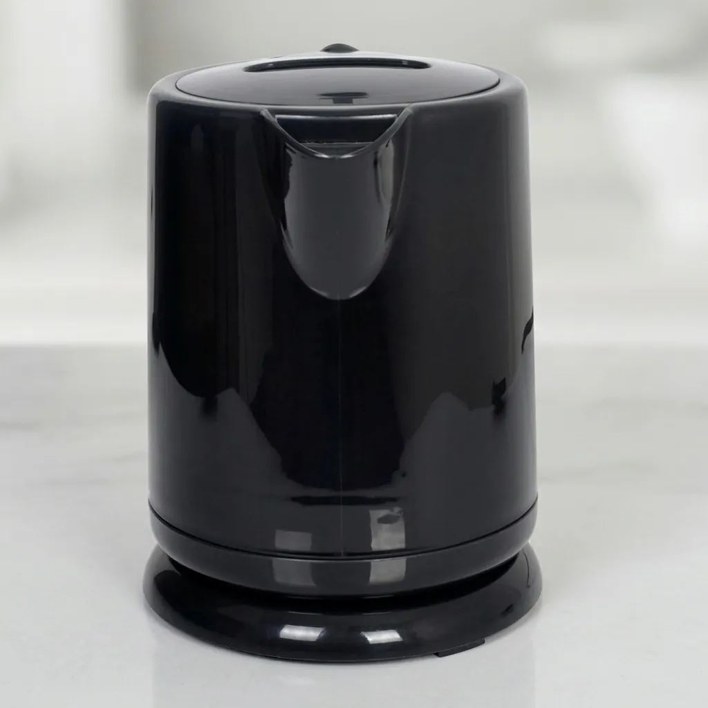 Stainless Steel Electric Kettle 0.8L with Triple Protection [1044] — KTL-1044 — A 0.8L electric kettle in food-grade 304 stainless steel with a durable UK Strix triple-protection controller. Rated 1350W with automatic shut-off, it boils quickly and safely for in-room beverage service. A compact, reliable choice finished in black. (image 7)
