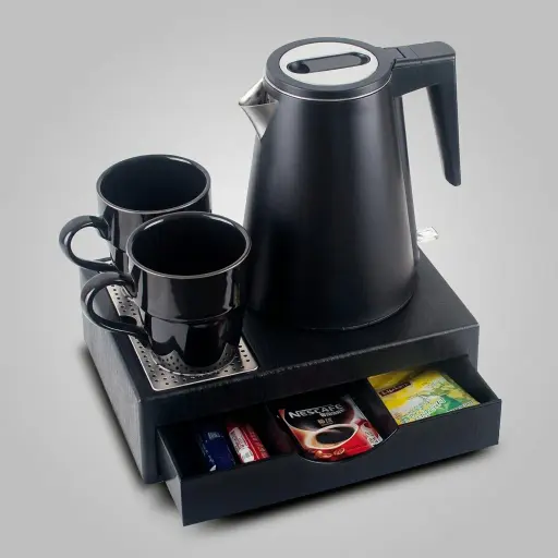 Wood Grain Drawer Set with Strix Seamless Stainless Steel 0.8L Kettle — KTS-1033 — A three-in-one welcome-tray set in tough wood-grain ABS with a fixed kettle base, deep drawer and three sachet-and-spoon compartments. A removable 304 stainless steel drip tray and space for two cups keep service tidy, paired with a 0.8L seamless 316 steel Strix kettle. Compact at 26.7x19x8cm, finished in black.