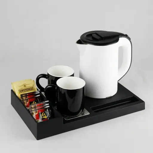 ABS Tray Set with Stainless Steel Anti-Scald 0.8L Kettle [1035] — KTS-1035 — A three-in-one ABS welcome tray with a fixed kettle base, three sachet compartments and a dedicated spoon section. A removable 304 stainless steel drip tray and space for two cups keep service neat, paired with a 0.8L anti-scald double-body kettle. A slim 35x20.4x5cm tray, available in black or white.