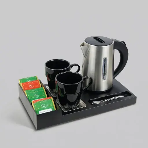 ABS Tray Set with Stainless Steel Double Body 0.6L Kettle [1037] — KTS-1037 — A three-in-one ABS welcome tray with a fixed kettle base, three sachet compartments and a spoon section. A removable 304 stainless steel drip tray and space for two cups keep service organised, paired with a 0.6L double-body kettle. A slim 35x20.4x5cm tray, in stainless steel or black.