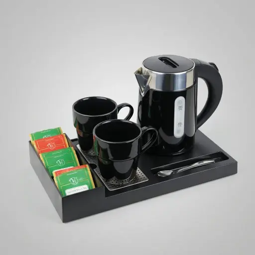 ABS Tray Set with Stainless Steel Double Body 0.6L Kettle [1041] — KTS-1041 — A three-in-one ABS welcome tray with a fixed kettle base, three sachet compartments and a spoon section. A removable 304 stainless steel drip tray and space for two cups keep service neat, paired with a 0.6L double-body kettle with water gauge. A slim 35x20.4x5cm tray, finished in black.