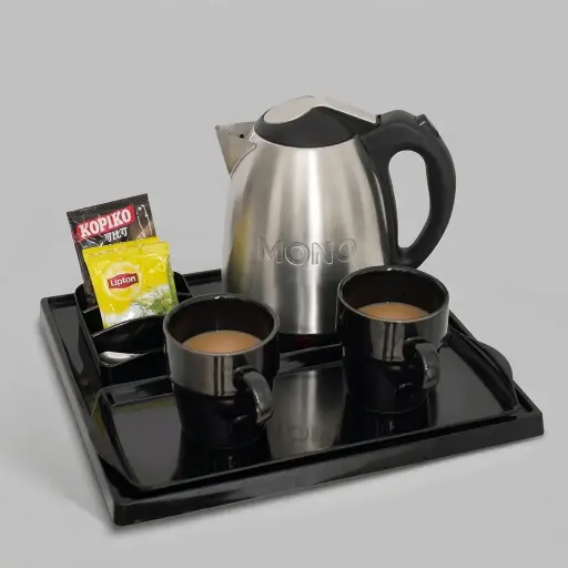 Melamine Tray Set with Strix Stainless Steel 1.2L Kettle with Matt Finish — KTS-1072 — A melamine welcome-tray set with a main tray, three-compartment tea box and matching serving tray in strong, fire-resistant non-crack melamine. The polished, easy-clean surface pairs with a 1.2L matt-finish Strix stainless steel kettle. The main tray measures 34.5x31.5cm, in stainless steel or black.