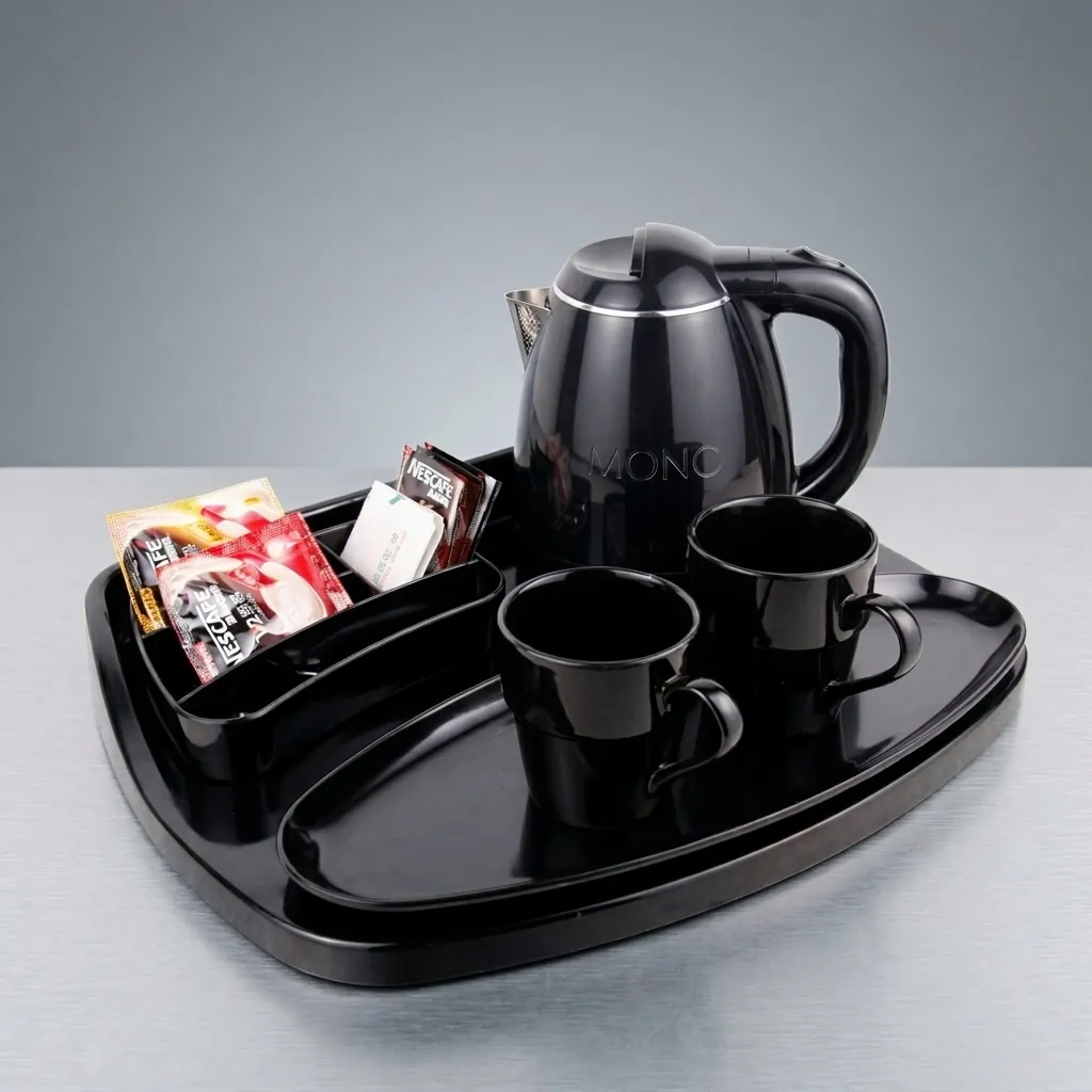 Melamine Tray Set with Strix Stainless Steel 1.2L Kettle [1073] — KTS-1073 — A premium melamine welcome-tray set with a large main tray, four-compartment tea box and matching serving tray in strong, fire-resistant non-crack melamine. The polished, easy-clean surface pairs with a 1.2L Strix-controlled stainless steel kettle. The roomy main tray measures 46.2x36.9cm, finished in black. (image 1)