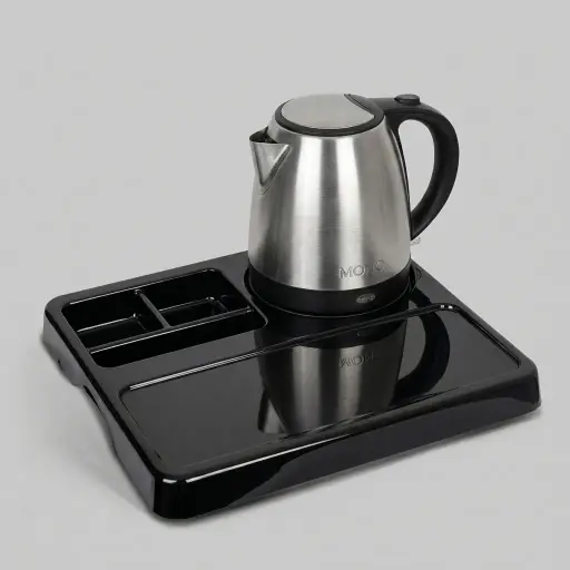 Melamine Tray Set with Stainless Steel 1.2L Kettle [1079] — KTS-1079 — A melamine welcome tray in strong, fire-resistant non-crack melamine with an integrated kettle base, three sachet-and-spoon compartments and space for cups. The polished surface is easy to clean, paired with a powerful 1.2L Strix stainless steel kettle. A 36.5x34cm tray in stainless steel or black.