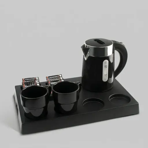 ABS Tray Set with Stainless Steel Double Body 0.6L Kettle [1085] — KTS-1085 — A three-in-one matt ABS welcome tray with a fixed kettle base, three sachet-and-spoon compartments and space for four cups. Rounded corners make it easy to clean, paired with a 0.6L double-body stainless steel kettle. A 40.5x26.8cm tray finished in black.