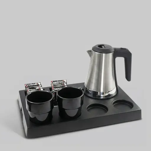 ABS Tray Set with Stainless Steel 0.8L Kettle [1090] — KTS-1090 — A three-in-one matt ABS welcome tray with a fixed kettle base, three sachet-and-spoon compartments and space for four cups. Rounded corners ease cleaning, paired with a 0.8L gun-finish stainless steel kettle. A 40.5x26.8cm tray finished in black.