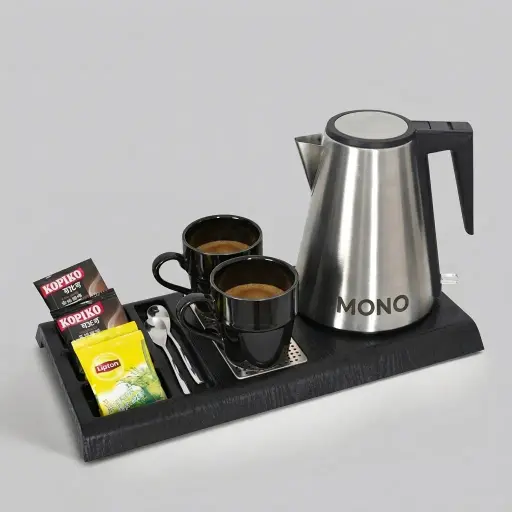 Wood Grain Tray Set with Stainless Steel 1.2L Kettle with Triple Protection — KTS-1104 — A three-in-one wood-grain ABS welcome tray with a fixed kettle base, four sachet-and-spoon compartments and a removable 304 stainless steel drip tray. Rounded corners ease cleaning, paired with a 1.2L stainless steel kettle with UK Strix triple protection. A 44.3x22.7cm tray finished in black.