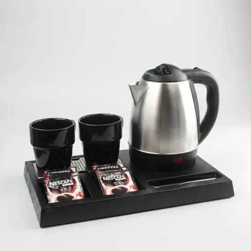 Wood Grain Tray Set with Stainless Steel 1.2L Kettle with Spout Strainer [1111] — KTS-1111 — A three-in-one wood-grain ABS welcome tray with a fixed kettle base, three sachet-and-spoon compartments and a removable 304 stainless steel drip tray. Rounded corners ease cleaning, paired with a 1.2L stainless steel kettle featuring a spout strainer. A compact 36.3x24cm tray finished in black.