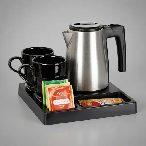 ABS Tray Set with Strix Stainless Steel 0.6L Kettle [1123] — KTS-1123 — A compact three-in-one ABS welcome tray with a fixed kettle base, four sachet-and-spoon compartments and a removable 304 stainless steel drip tray. Tough and easy to clean, it pairs with a 0.6L Strix-controlled stainless steel kettle. A space-saving 24x24cm tray, in stainless steel or black.