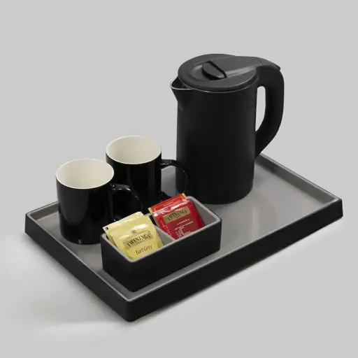 PU Leather Tray Set with Stainless Steel Anti-Scald 0.8L Kettle [1129] — KTS-1129 — An elegant rectangular welcome tray in ABS wrapped with customisable PU leather, with a non-slip pad and a cable cut-out for the kettle. Water-repellent and easy to clean, it presents the kettle, mugs and utensils with a matching tea bag holder, paired with a 0.8L anti-scald kettle. A 39x26cm tray, in black or grey.