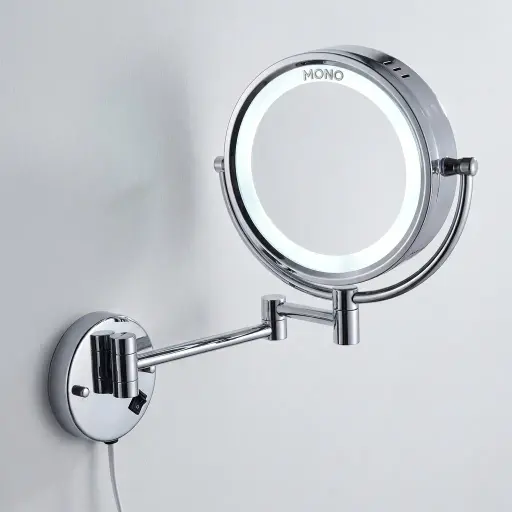 Wall Mounted Magnifying Mirror With LED Light 8.5" [1025] — MGM-1025 — A wall-mounted dual-sided vanity mirror with a built-in LED light, combining a normal mirror with a 3x magnifying side. The 8.5-inch chrome-finished copper frame adds a refined touch, with a long-life 60,000-hour LED. Dual-voltage 110/220V, finished in silver.