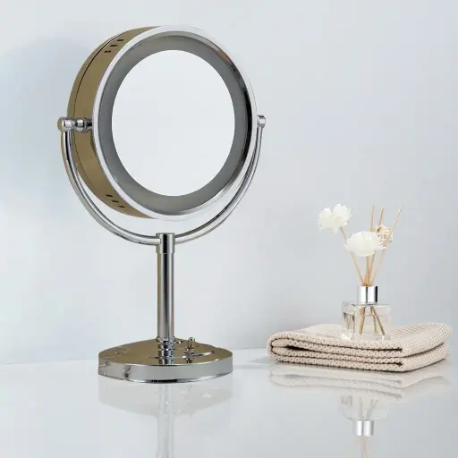 Desktop Magnifying Mirror With LED Light 8" [1029] — MGM-1029 — A freestanding desktop vanity mirror with a built-in LED light and single-sided 3x magnification for clear, close-up grooming. The 8-inch copper-framed mirror uses a long-life 60,000-hour LED. Dual-voltage 110/220V, finished in silver.