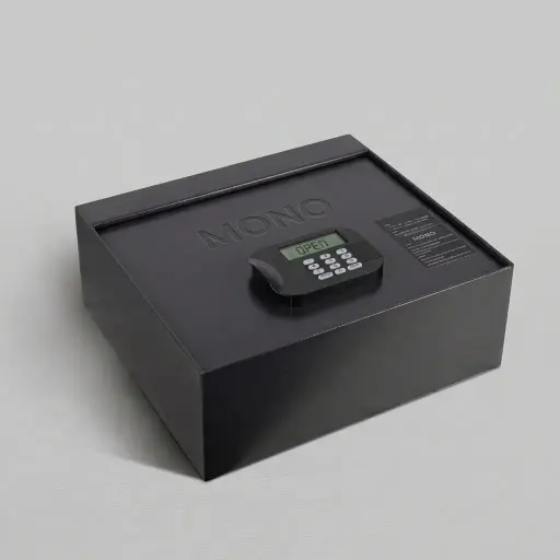 Heavy-Gauge Top-Opening Safe with Pneumatic Lid [1031] — SFB-1031 — A top-opening hotel safe in arc-welded heavy-gauge steel with a 1.5mm body, reinforced 4mm door and an 18mm solid steel bolt. A backlit LED keypad takes a 4 to 6 digit guest code with master-code and key override, plus a 5-minute lockout after three wrong tries. The pneumatic lid and pre-drilled mounting holes ease daily use, powered by 4 AA batteries, in black or orange.