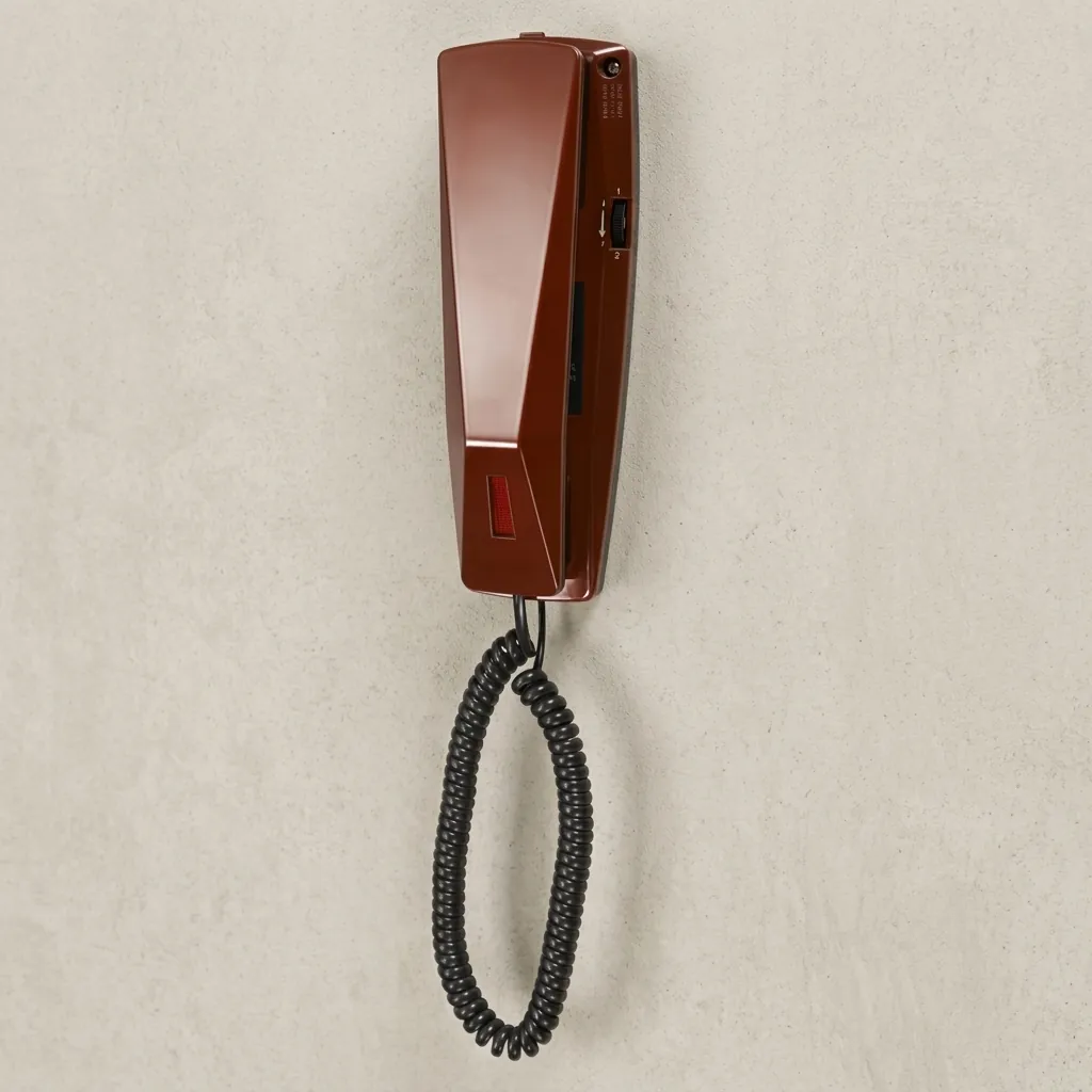 Telephone For Hotel Room - Uv Oil [1052] — TEL-1052 — A hotel room telephone with an ergonomic design and a high-gloss UV-coated shell that resists fading. A soft ring tone, ring-indicator light, SOS emergency key, auto-redial and mute round out the features, with protection against EMI, moisture and lightning. Desk or wall mountable, finished in red. (image 5)